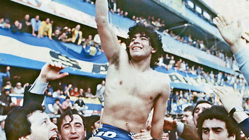 (FILE) This 1981 picture shoes Argentine soccer star Diego Armando Maradona, being carried by fans after winning the 1981 local Championship with Boca Juniors at La Bombonera stadium in Buenos Aires. Boca Juniors, the most popular football club in Argentina, celebrates on April 3rd, 2005, its centenary - from its creation by a group of football enthusiast in a humble neighbourhood of immigrants, until reaching the world's summit, and counting among its supporters with the most famous fan, Diego Armando Maradona. AFP PHOTO/DIARIO POPULAR/NA ARGENTINA OUT (Photo credit should read DIARIO POPULAR/AFP/Getty Images)
